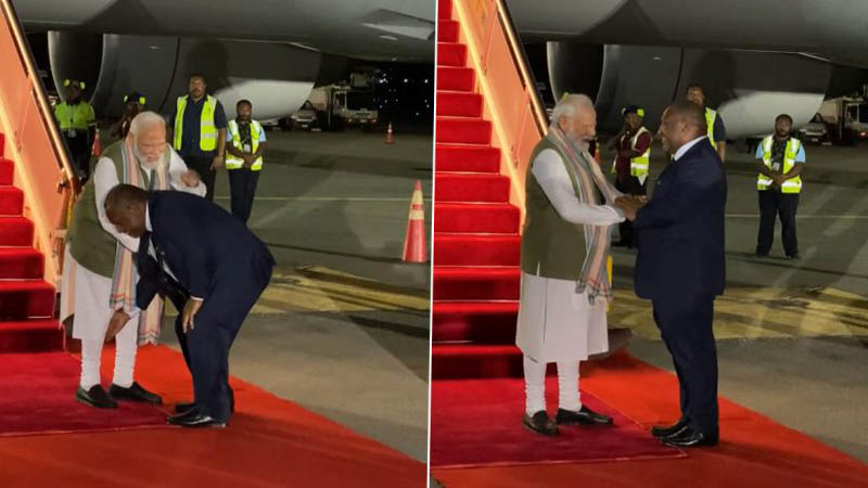 papua new guinea pm touches India prime minister modi feet
